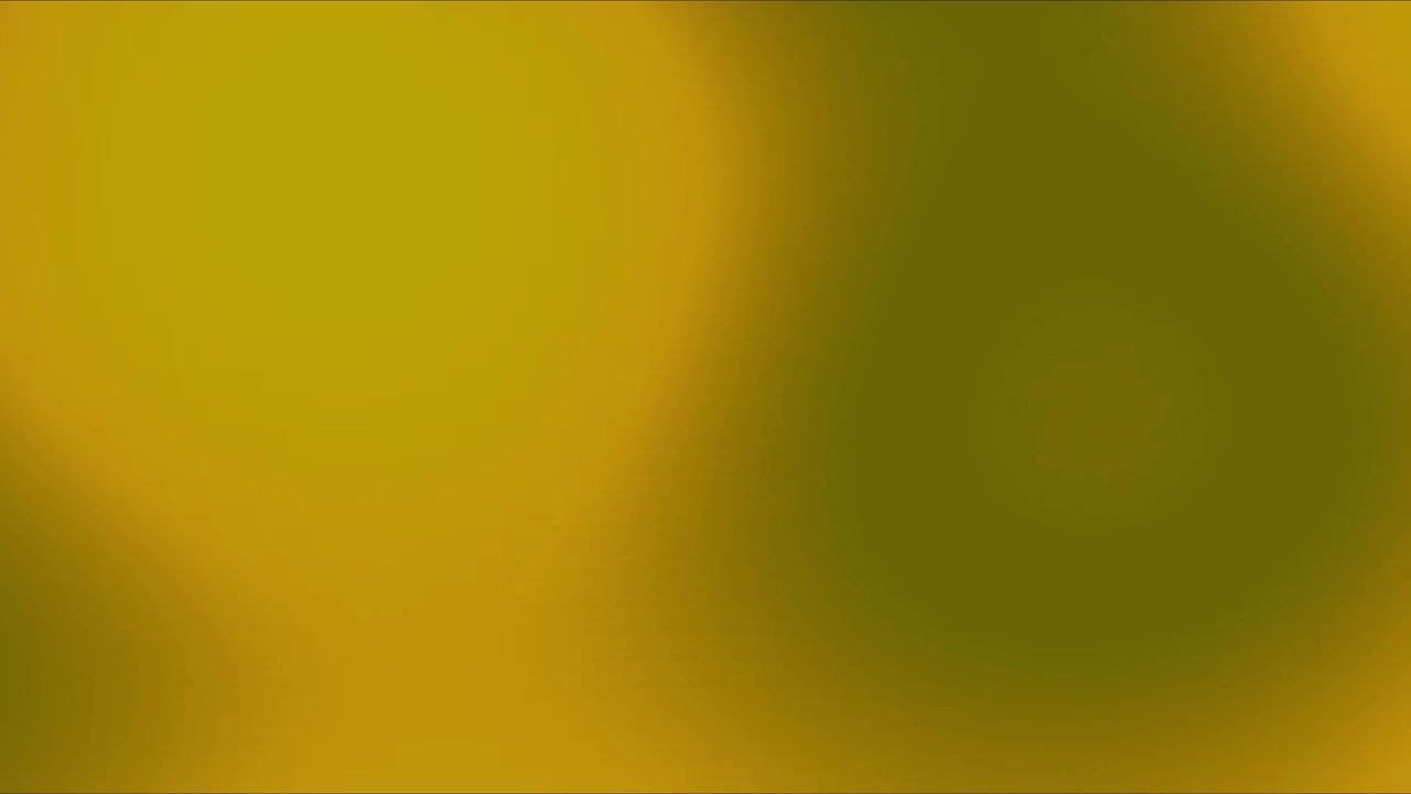 Абстрактный анимированный фон с мягкими желтыми и зелеными световыми бликами.