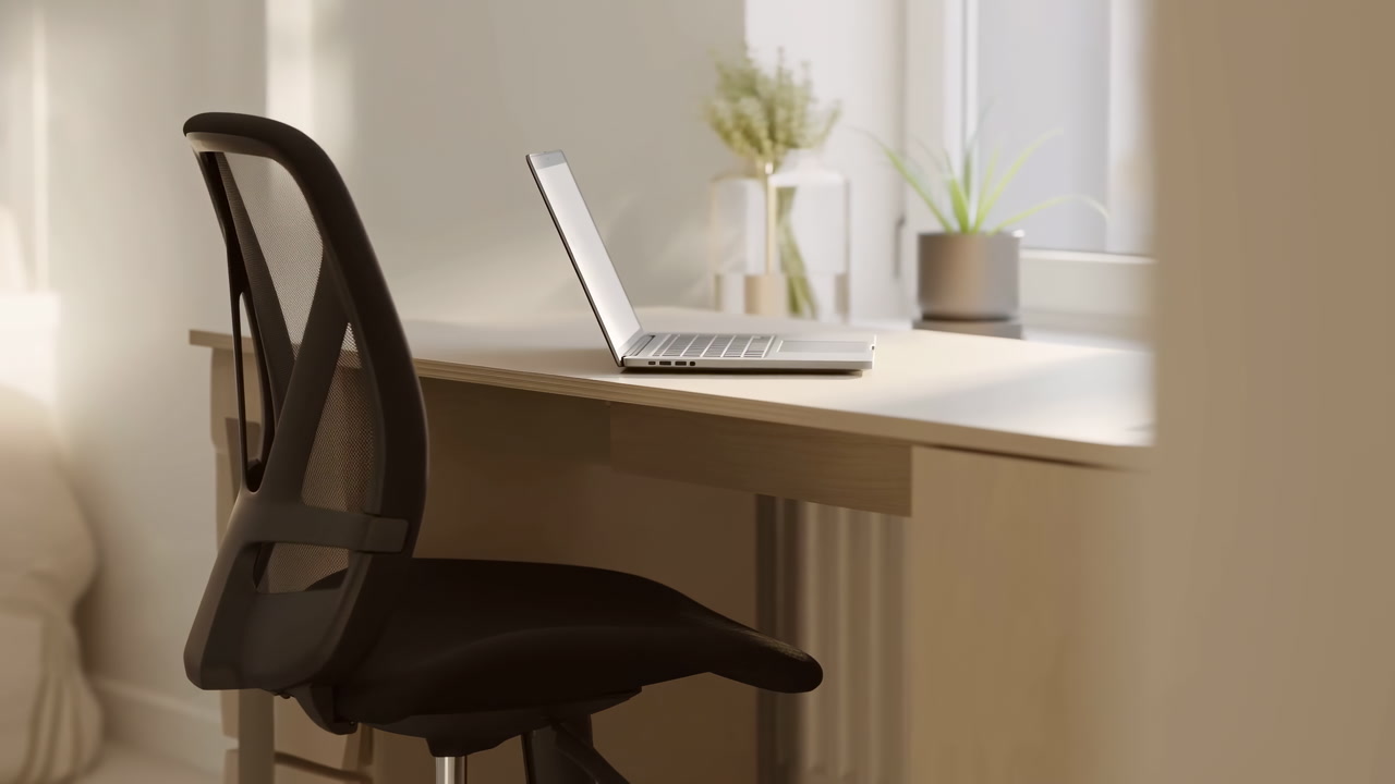 Sunlit Home Workspace With Laptop Minimalist Wooden Desk Ergonomic Black Chair Pulled Back Small Potted Plant