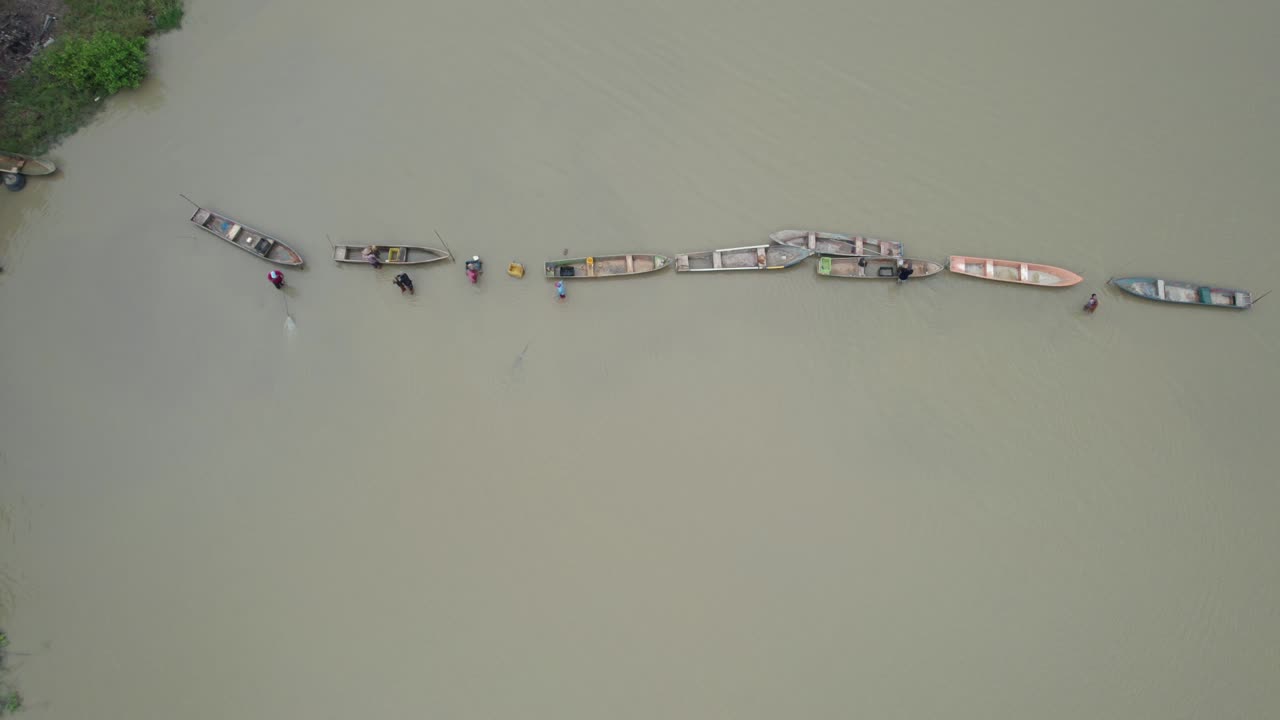 Aerial view of fishermen with nets on Unare for a calm fishing day