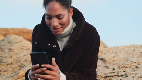 african american girl using mobile phone.