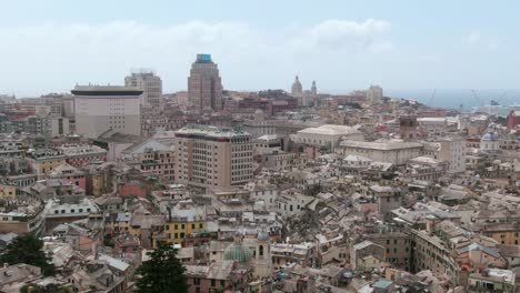 Majestic-downtown-of-Genoa-city-with-skyscrapers,-aerial-cinematic-view