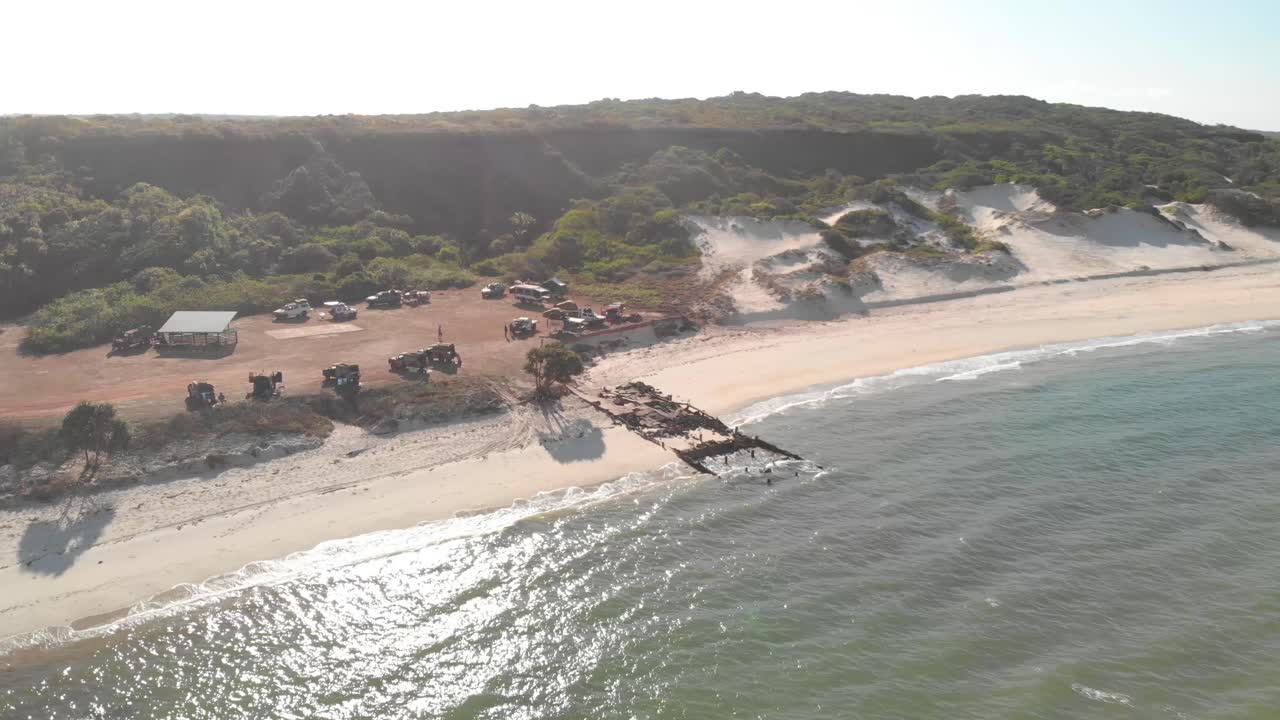 Beach with Wreckage and Vehicles