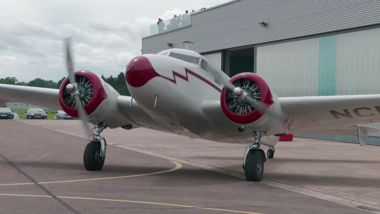 Vintage Twin Engine Airplane at Airport