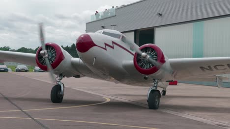 vintage twin engine airplane at airport
