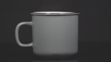 filling cup with hot water with vapour, slow motion 4k