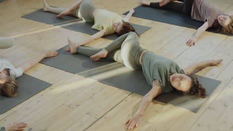 women practicing yoga or stretching in a group class