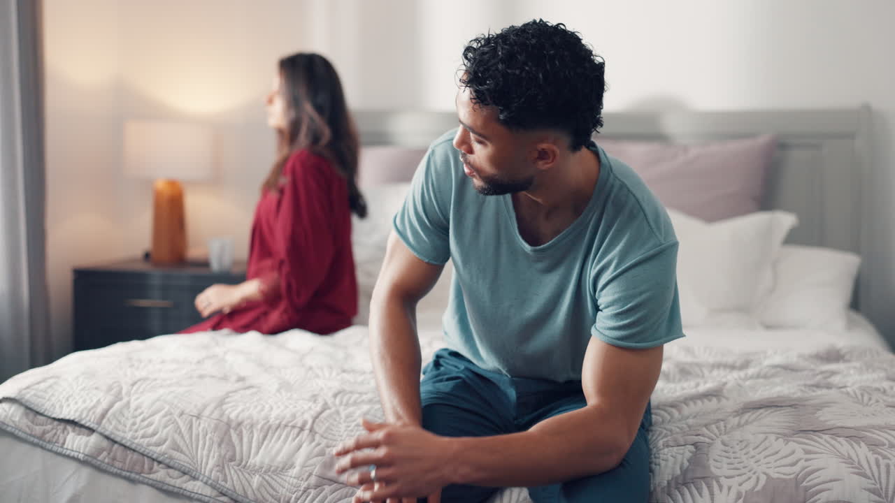 Unhappy Couple Experiencing Relationship Difficulties in Bedroom