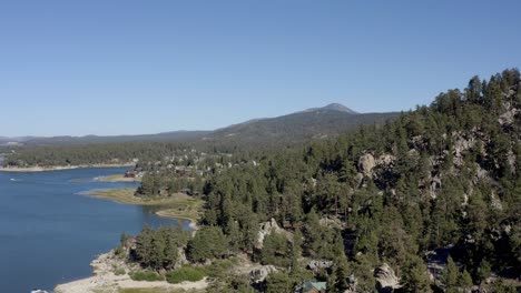 A-beautiful-aerial-drone-shot-flying-close-to-the-mountainside-at-Big-Bear-Lake,-San-Bernardino-County,-California