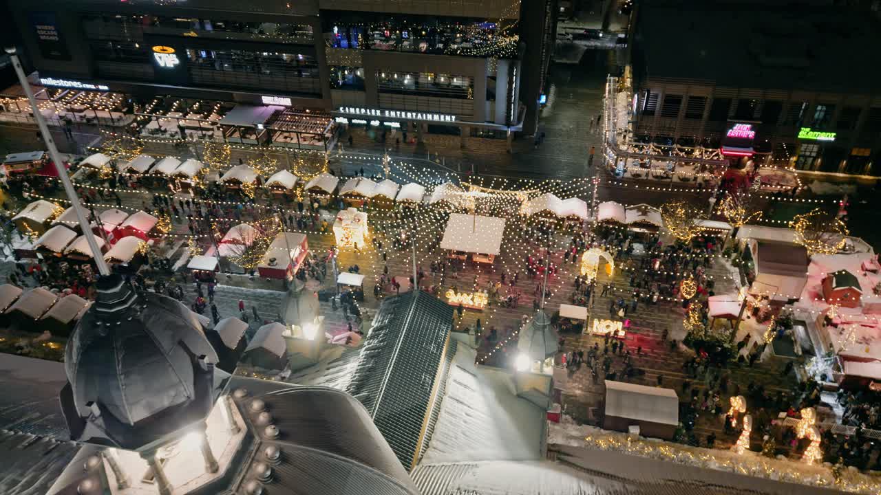 Aerial Dolly Right Over Aberdeen Pavilion Dome Top With View Of Illuminated Lansdown Christmas Market In Ottawa At Night