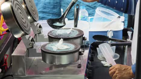 making street food at a food cart