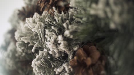 slow motion of christmas advent wreath crown with pine cones - shallow focus close up