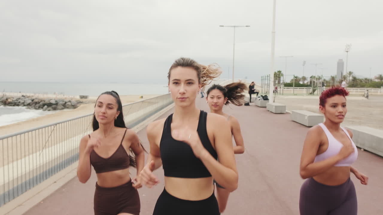 Four Women Running by the Beach