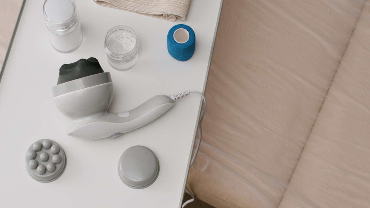 Massage and recovery tools on a white table