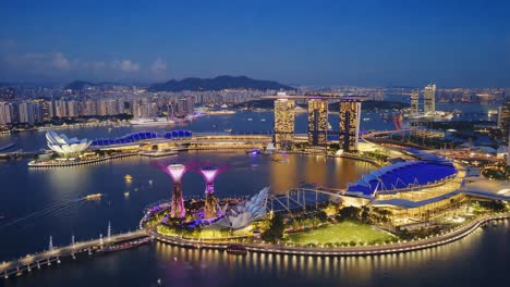 panoramic night view of singapore's marina bay skyline with supertrees and city lights