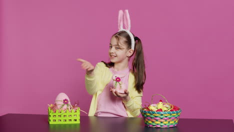 young schoolgirl blowing air kisses in front of camera