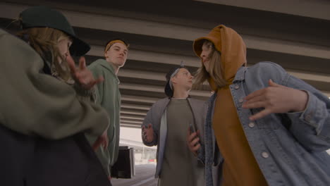 dance crew under a bridge