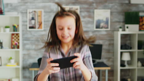 Cheerful-daughter-jumping-on-the-couch