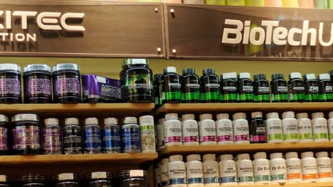 sport nutrition store interior with large choice of nutritional supplements.