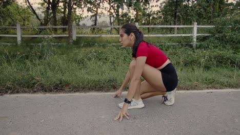 woman in starting position for a run