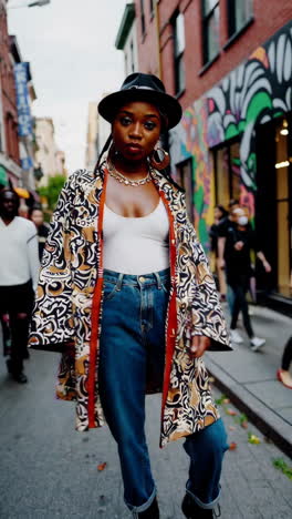 stylish woman in trendy outfit on city street