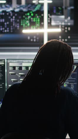 vertical video data center computer scientist using node tree software to analyze datasets