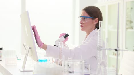 female scientist conducting research in a modern laboratory
