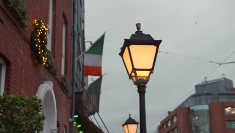 typical vintage streetlamp on the urban streets in dublin, ireland