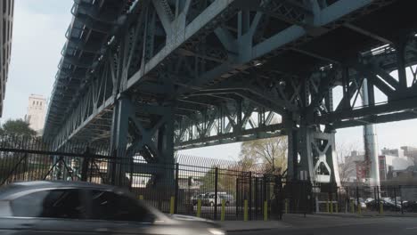 cars pass under the ben franklin bridge