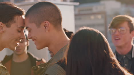 young-homosexual-couple-dancing-together-enjoying-rooftop-party-at-sunset-sharing-intimate-connection-group-of-friends-having-fun-celebrating-summer-vacation