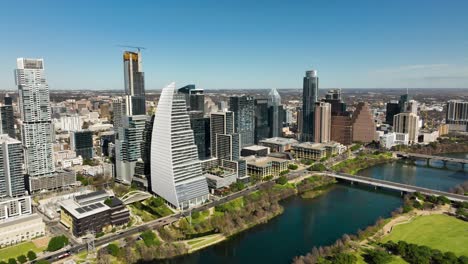 aerial shot of downtown austin, tx with the colorado river in frame