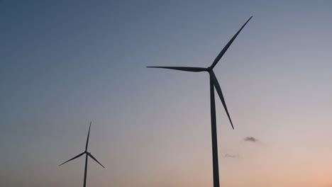 Wind-Turbines-Silhouette-against-the-Blue-sky-during-Sunset,-clean-alternative-energy-in-Thailand-and-mainland-Southeast-Asia