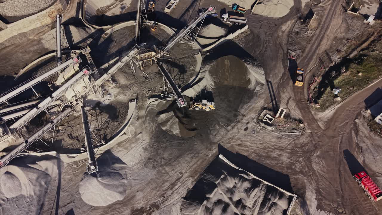 Quarry displaying machinery and materials at an industrial site