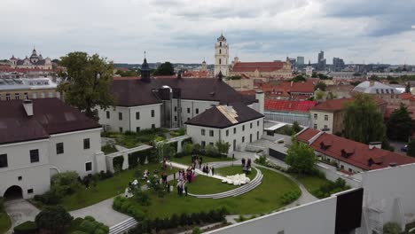 aerial view of boksto skveras, featuring a spacious square surrounded by historic buildings, lush greenery, and well-maintained pathways