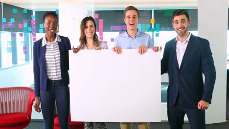 Portrait-of-business-colleagues-holding-a-blank-banner-4k