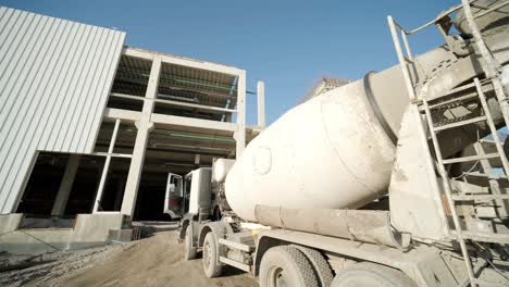 the concrete mixer at the industrial plant. builders are building a factory, hangar.