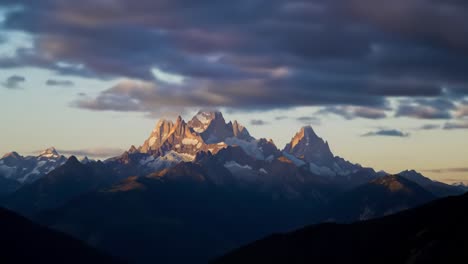 a stunning visual journey through majestic mountain peaks: from daylight glory to the enchanting twilight of nature's splendor