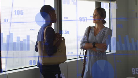 Animation-of-multiple-graphs-and-changing-numbers-over-diverse-female-coworkers-discussing-in-office