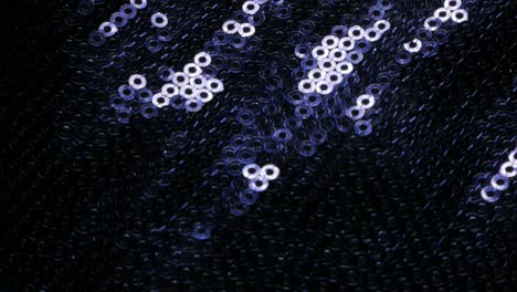 Blue shiny sequin fabric reflecting light 4K 2160p UltraHD tilt footage - Slow tilting over blue sequins on dress 4K 3840X2160 30fps UHD video