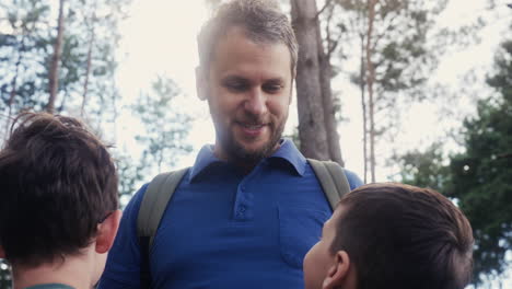 man and children at the forest