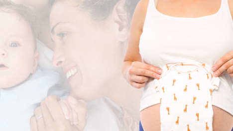 animation of happy caucasian woman with baby and pregnant caucasian woman holding baby clothes