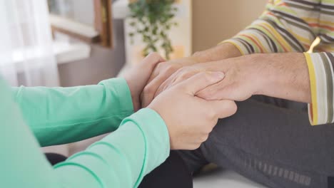 nurse holding hands of female patient.healthcare support concept.