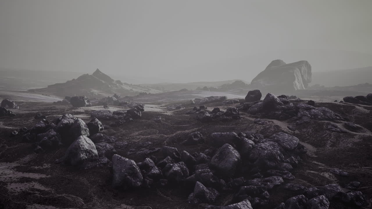 Barren and desolate landscape with rocky formations in muted tones