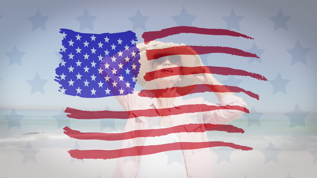 미국  ⁇ 발이 해변에서 모자를 입은 백인 고령 여성 위에 흔들리고 있습니다.