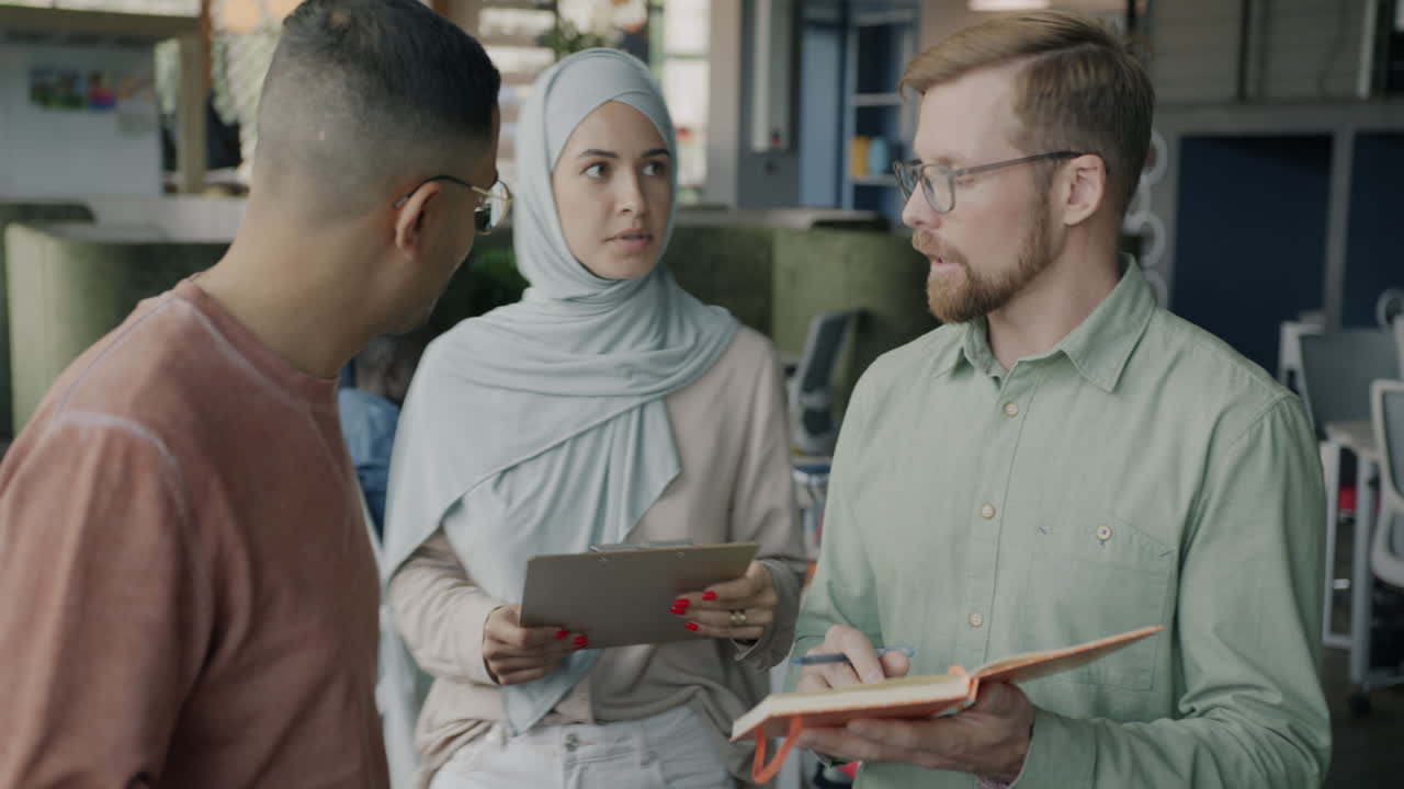 Diverse Team Discussing in Modern Office