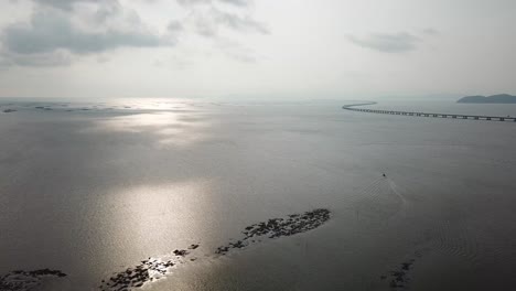 Aerial-view-fishing-boat-head-the-direction-of-Penang-second-Bridge.