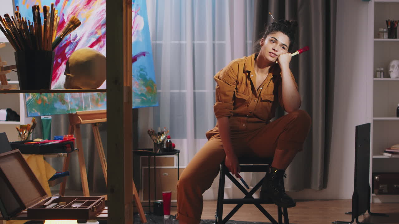 Thoughtful painter in art studio