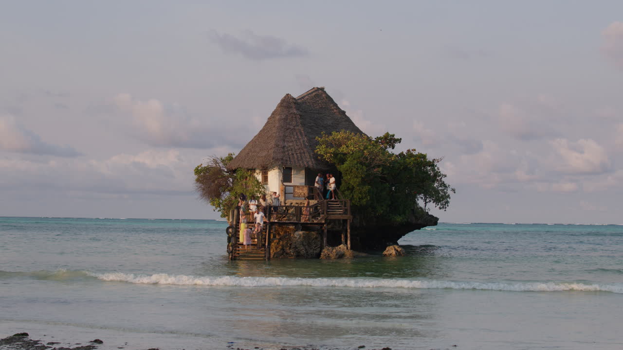 View of the Rock restaurant during high tide, on a small remote island. Tanzania, Zanzibar.