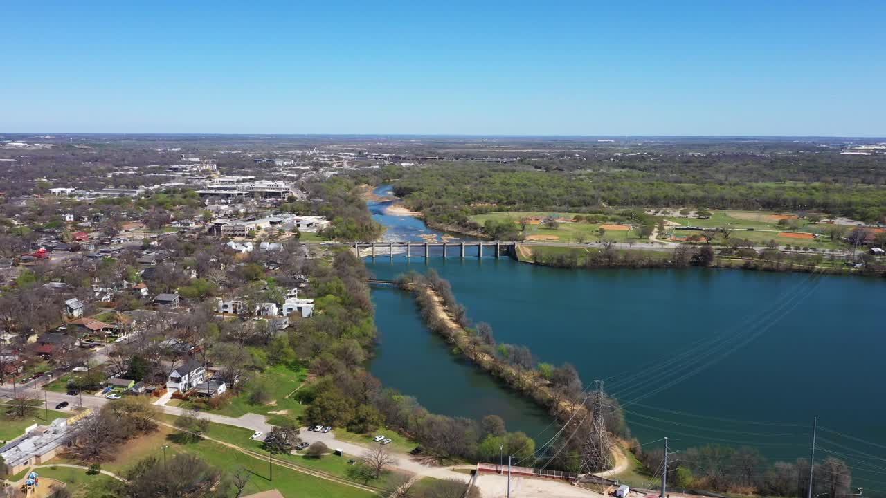Drone flies toward the bridge over the Lake