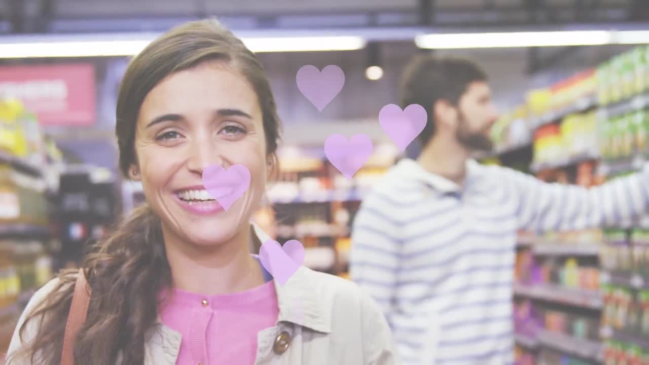 가게에 있는 백인 부부 위에 떨어지는 심장 아이콘의 애니메이션