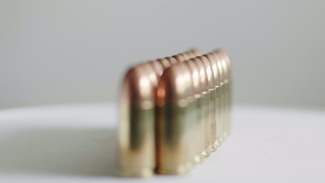 Close-up-of-many-ammunition-are-arranged-in-a-row-and-rotated-with-a-rotating-platform